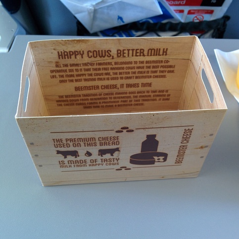 KLM sandwich box on flight from CWL to AMS with note 'The premium
cheese used on this bread is made of tasty milk from happy cows.' KLM sandwich box on flight from CWL to AMS with note 'The premium
cheese used on this bread is made of tasty milk from happy cows.'